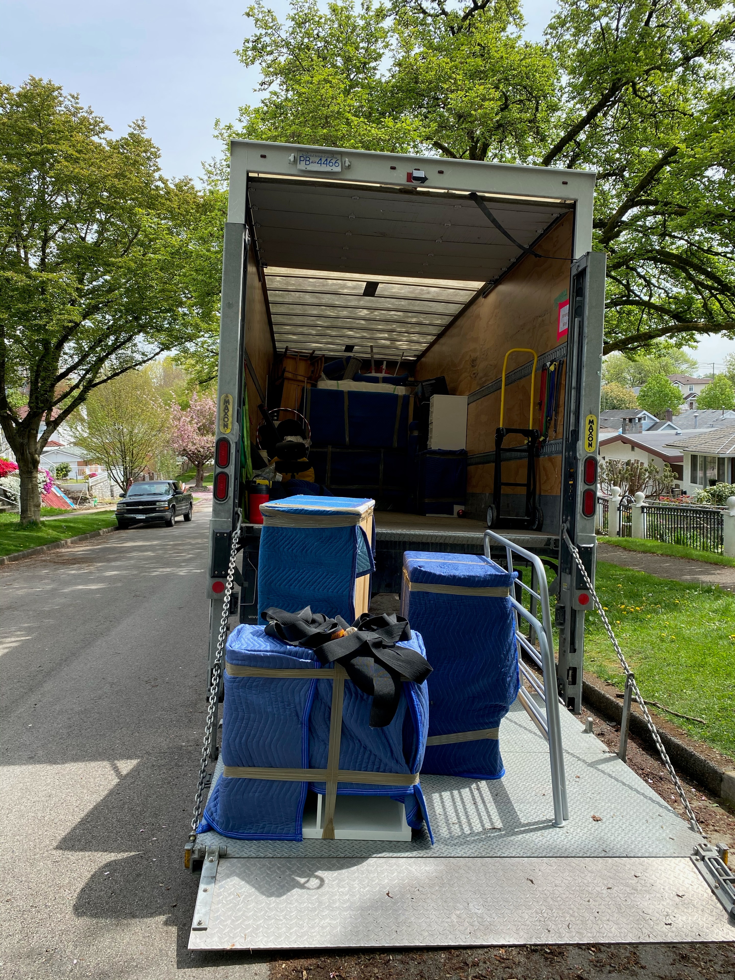 Moving truck loaded with padded furniture